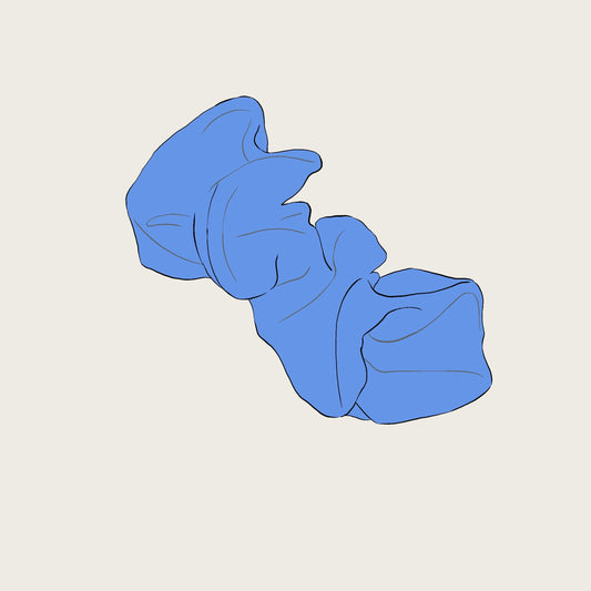 Blue scrunchie on a beige background