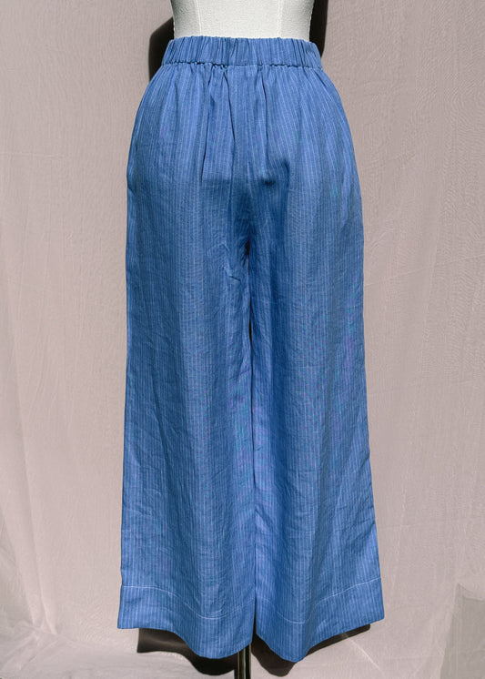Blue pinstripe pants on a mannequin against a plain background