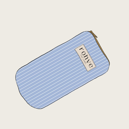 Blue stripe pouch with a brand label on a light beige background sketch 