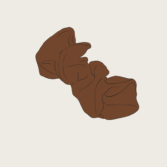 Brown scrunchie on a beige background