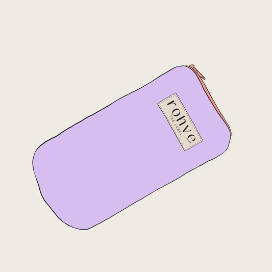 Lilac pouch with a brand label on a light beige background sketch