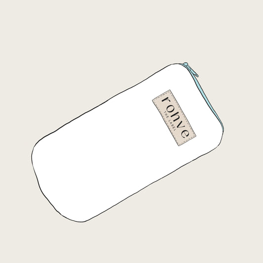 White pouch with a brand label on a light beige background sketch